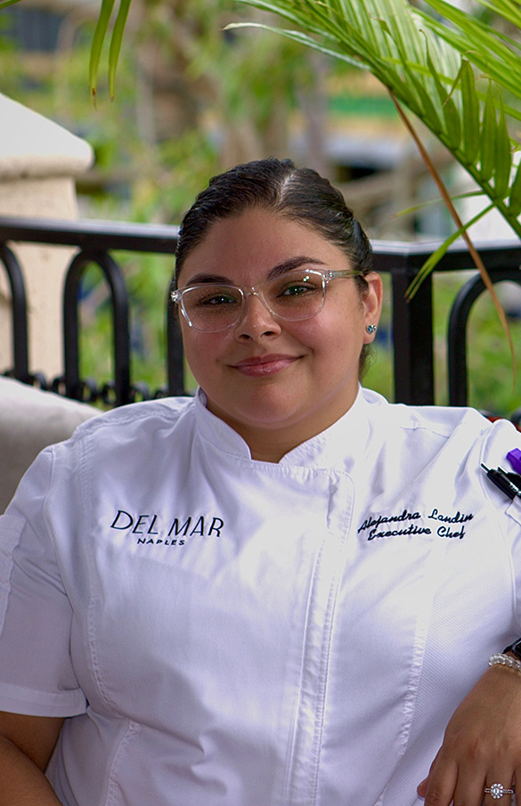 Executive Chef Alejandra Landin, seated on the terrace at Del Mar restaurant in Naples, Florida.