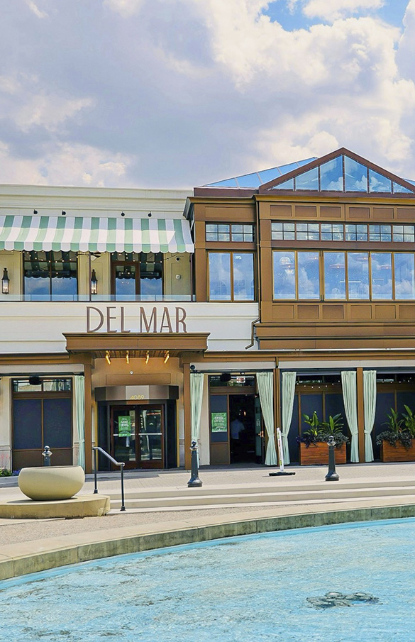 Exterior of Del Mar Mediterranean restaurant in Columbus, Ohio at Easton Town Center on a sunny day.