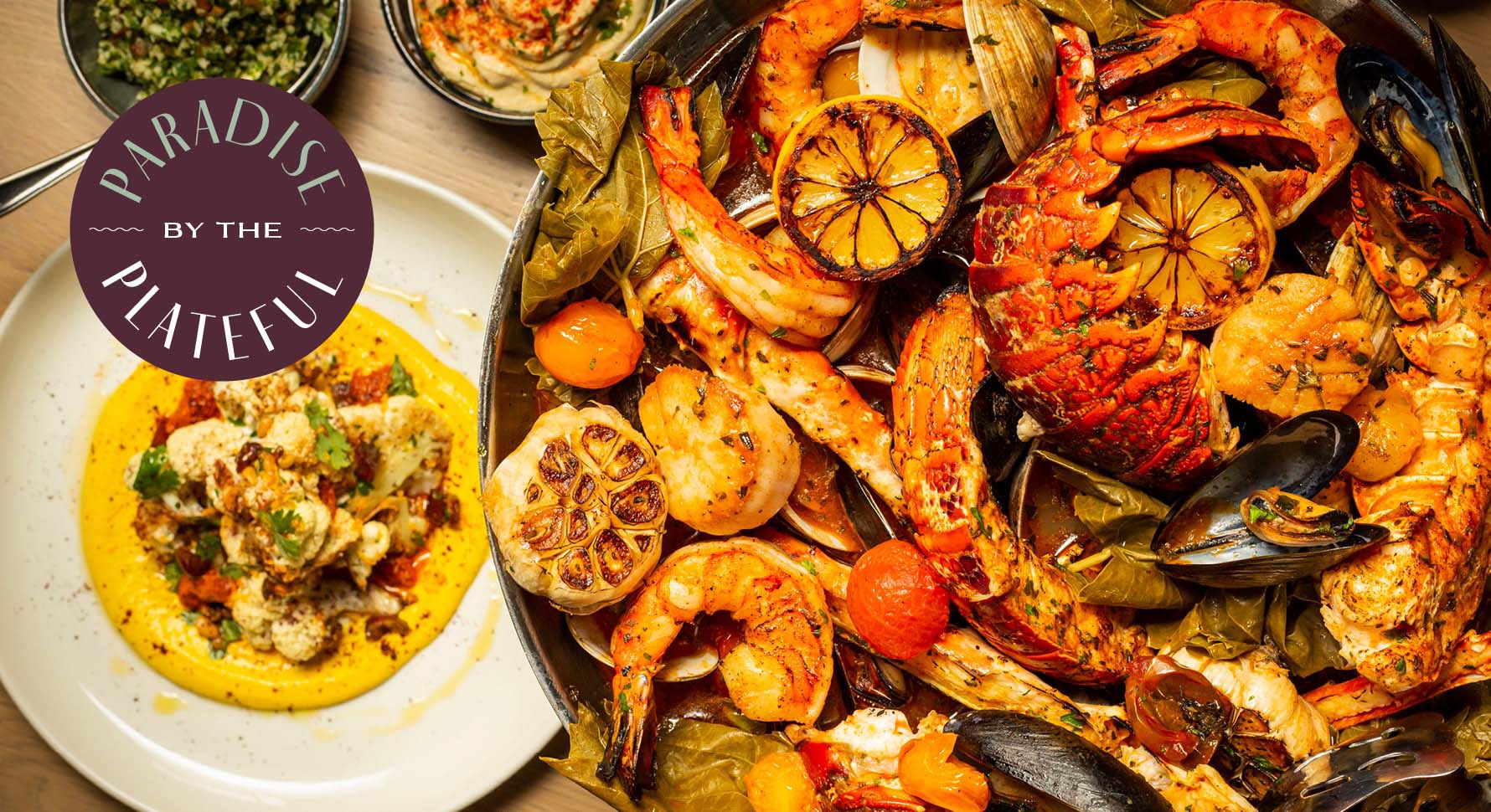 Bird's eye view of plated Roasted Seafood Platter served at Del Mar Mediterranean restaurant.